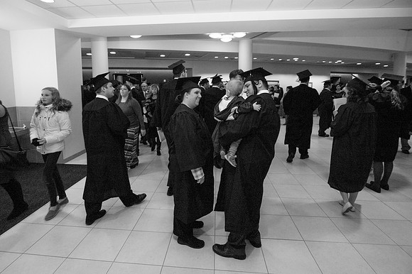 Graduates and family gather outside the I-Center after Commencement to mingle before Convocation.