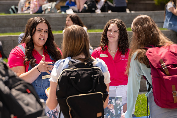 Spirit Fest Booths on campus, students talking and having fun together.