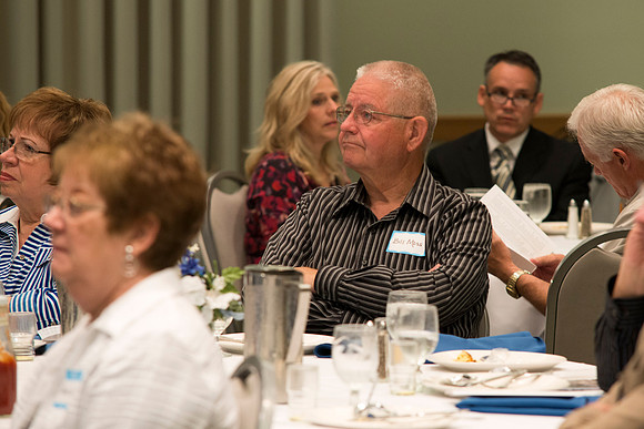 Alumni of the class of 1964 and earlier gather and honor the Briggs for their service.