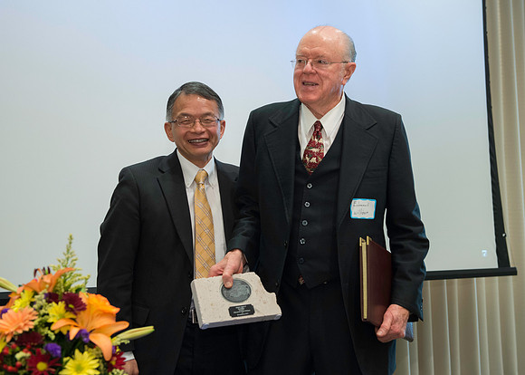 Kevin Myasaki presents the Alumni Award of Excellence to Ed Williams.