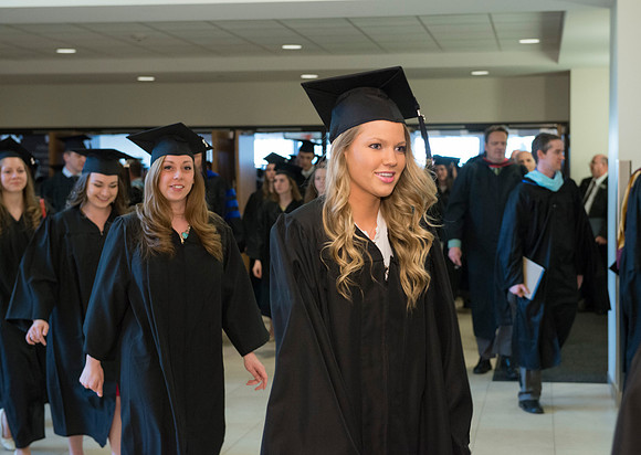 Graduates gather and march in during the processional for April 2014 Graduation ceremonies in the BYU-Idaho Center.