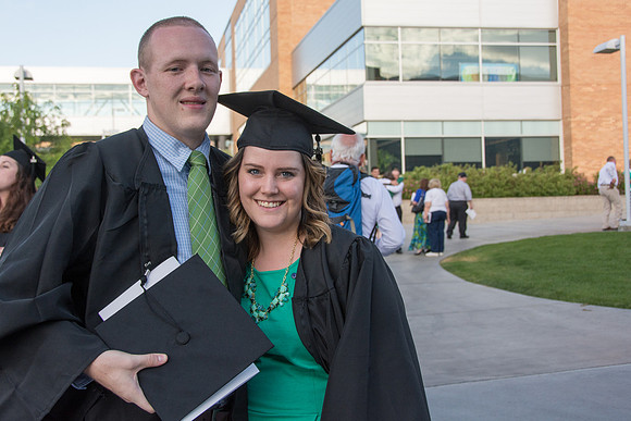 Faculty, family and graduates around campus after the commencement ceremony.