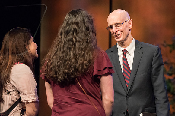 President Henry J. Eyring interacts with students after devotional.