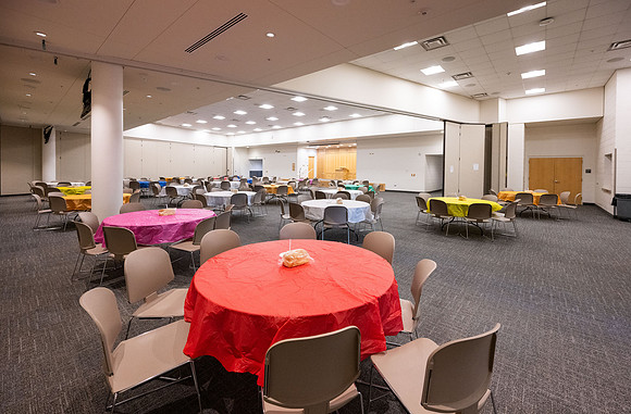 Taylor building room 160 and 170 set up with round tables for a Stake Relief Society Social.