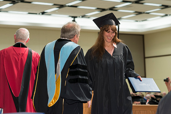 College of Language and Letters Convocation in the Manwaring Center Ballroom. Dean, John Ivers congratulates the graduates.