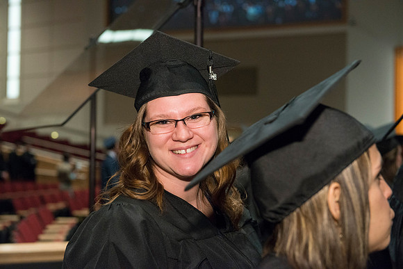 Graduates gather and march in during the processional for April 2014 Graduation ceremonies in the BYU-Idaho Center.