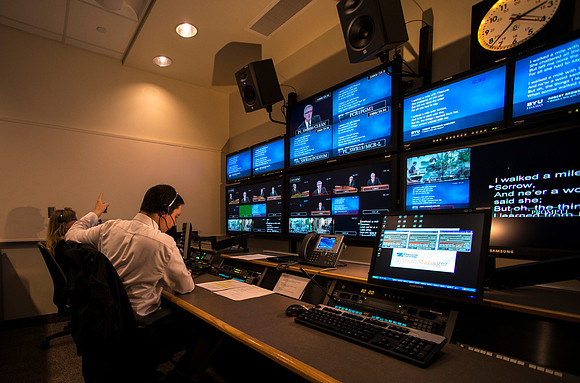 Behind the scenes of devotional in the AV_Control Room. Mike Jeffs directs the camera's during devotional.