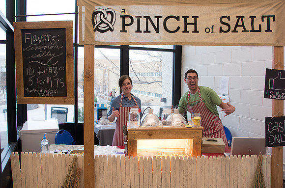 IBC students from the Business program on campus sell pretzels in the Smith Building.