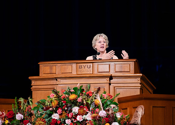 Elder and Sister Boom speak at devotional in the BYUI Center.