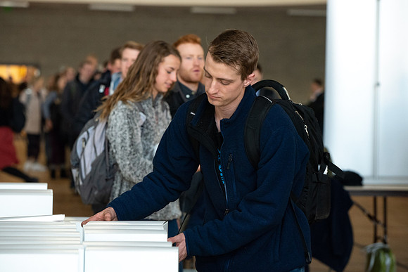 Students pick up their $2 box lunch after devotional for the first time.