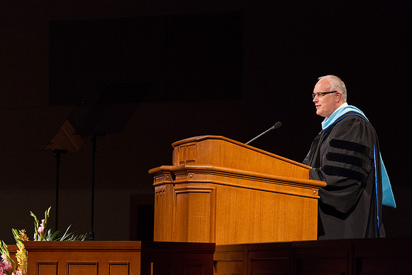 Paul V. Johnson, Commissioner of the Church Education System talks briefly to the 2014 Spring Semester Graduates during commencement in the I-Center. Photo by Tyler Rickenbach