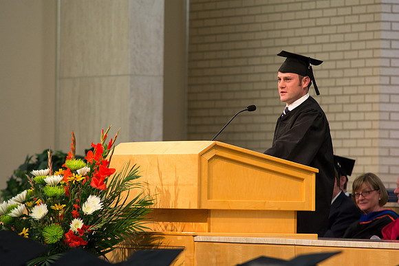 Graduate John Dalton speaks at the convocation ceremony for the College of Physical Sciences and Engineering held in the Taylor Chapel.