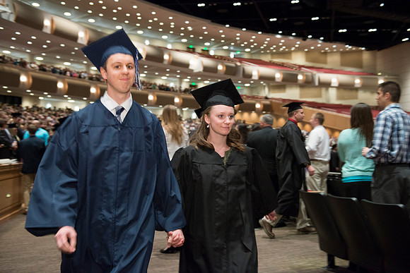 Graduates gather and march in during the processional for April 2014 Graduation ceremonies in the BYU-Idaho Center.