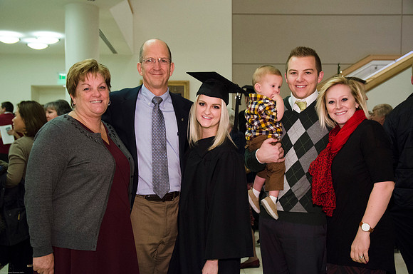 Rhegan Winters gathers with her family after Graduation Commencement.