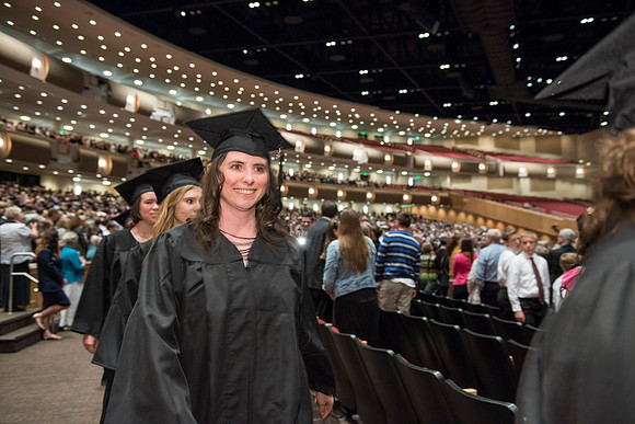 Graduates gather and march in during the processional for April 2014 Graduation ceremonies in the BYU-Idaho Center.