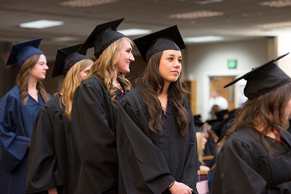 Students of the College of Human Development receive their diploma cover.