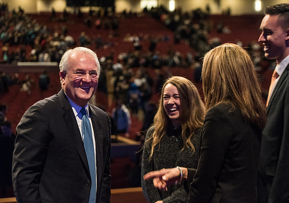 Elder Gerard talking with students after devotional.
