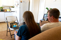 A couple watching Elder and Sister Renlund's live broadcast devotional to BYU-Idaho from Salt Lake City because of travel restrictions during Covid-19 pandemic.