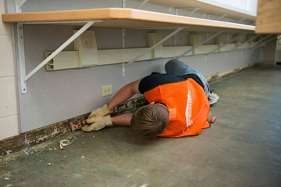 Servpro team members work hard to clean parts of the Smith Building.