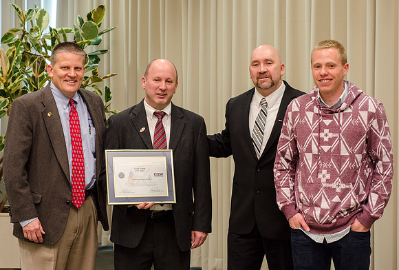 Todd Smith receiving an award on behalf of BYU-Idaho from the Office of the Secretary of Defense for the support BYU-Idaho has given to Peter Stilling while he has been serving in the Guard. Awarded b