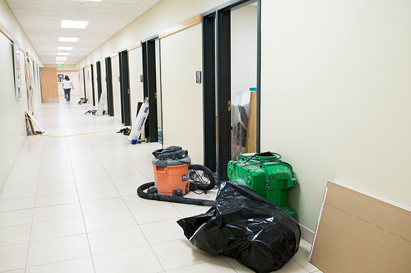 Hallway scattered with equipment as the rooms are renovated.