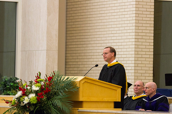 Eric B. Karl, Dean of Physical Sciences and Engineering College welcomes graduates, faculty and family to Convocation in the Taylor Chapel.