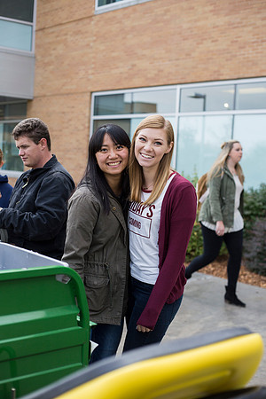 Best friends Callie Su and Sage Sabey smile for the camera outside the Manwaring Center.