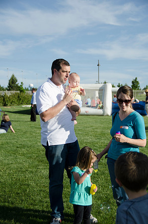 Online instructors gather with their families for an eveing of BBQ and games.