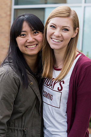 Best friends Callie Su and Sage Sabey smile for the camera outside the Manwaring Center.
