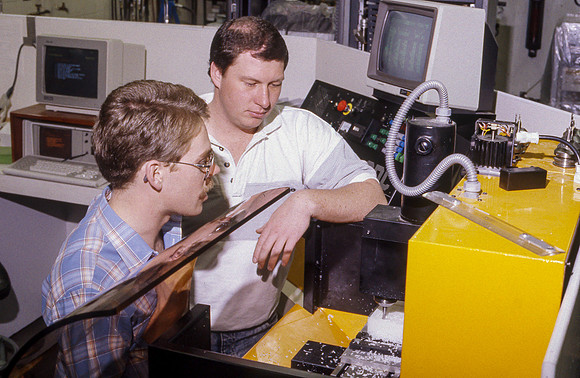 Student works alongside teacher in Manufacturing Technology. January 1990.
