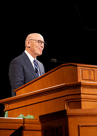 Elder Arnulfo Valenzuela giving a speech at the devotional.