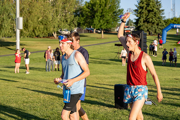 Students gather at the upper field for various 4th of July activities.