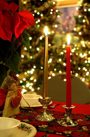 Beautiful Christmas decor with candles trees and lights.
