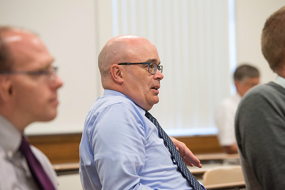 Faculty gather in the Hinckley Building for a conference to learn from their peers.