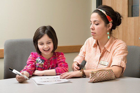 Teacher Education students offer their services tutoring kids 3rd grade to 12th grade. Kim Argueta tutoring Jenna Davis.