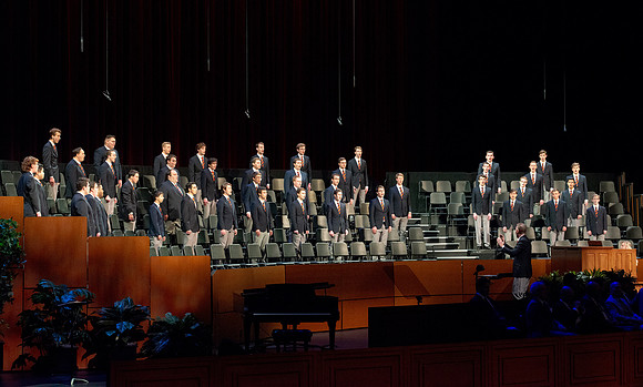 Men choir performing for devotional.