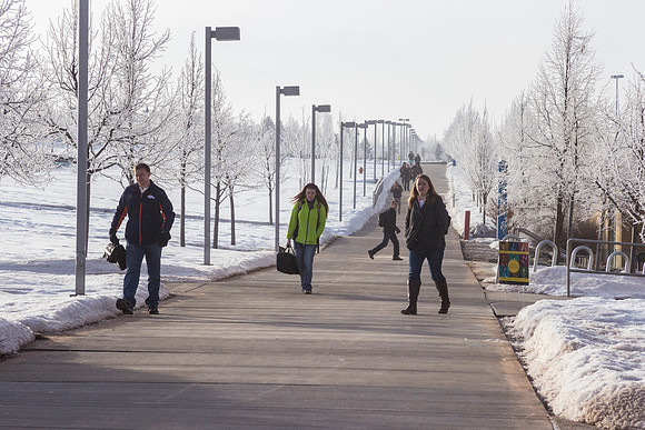 Students brave the cold to make it to class on time.
