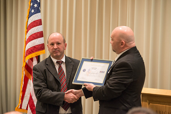 Todd Smith receiving an award on behalf of BYU-Idaho from the Office of the Secretary of Defense for the support BYU-Idaho has given to Peter Stilling while he has been serving in the Guard. Awarded b
