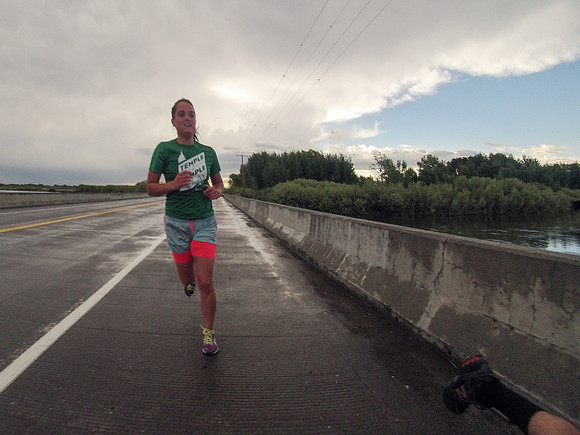 A runner passes Beaver Dick Park along highway 33.