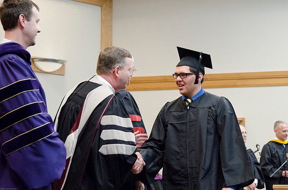 Student Graduates at the College of Education and Human Development Convocation in the HInckley Chapel.