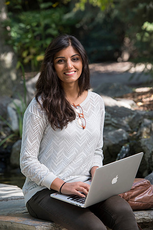 Student Noor Sofi poses in the Gardens for online learning.