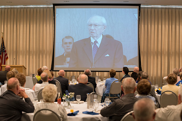 Alumni of the class of 1964 and earlier gather and honor the Briggs for their service.