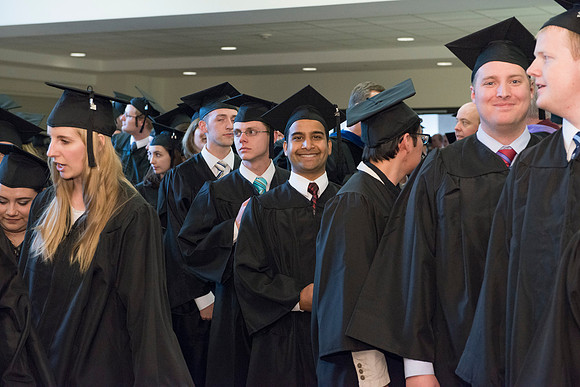 Graduates gather and march in during the processional for April 2014 Graduation ceremonies in the BYU-Idaho Center.