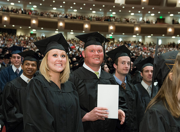 Graduates gather and march in during the processional for April 2014 Graduation ceremonies in the BYU-Idaho Center.