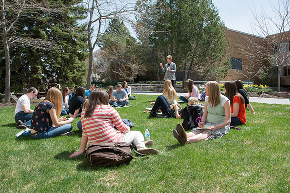 A class meets outside for their first meeting of the spring semester.