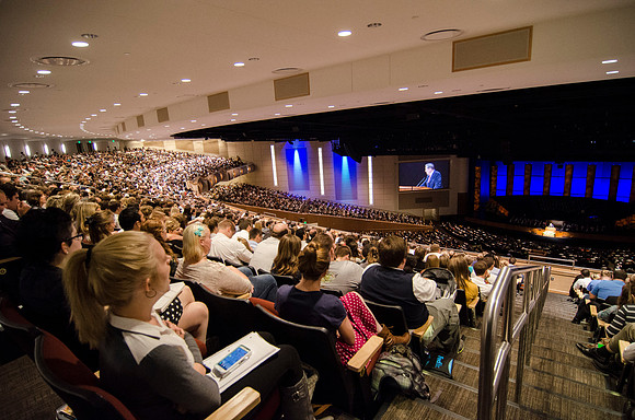 Students gather in the BYU-Idaho Center for devotional to listen to Elder Holland.