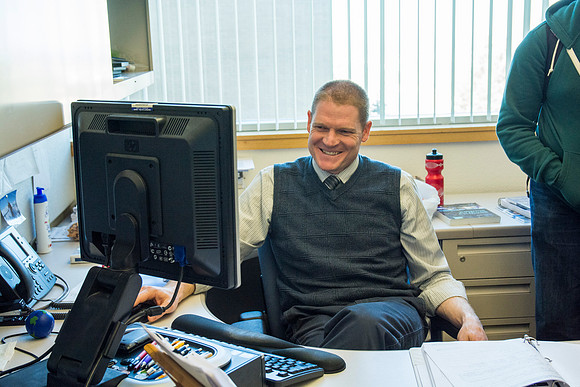 Jeremy Lamoreaux, faculty member of the Brigham Young University-Idaho Political Science department, with students in his office.