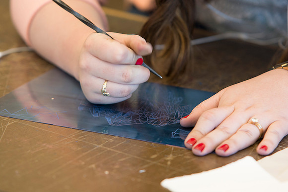 A student in Sister Jimison's Printmaking class works on an assignment during class in the Spori Building.