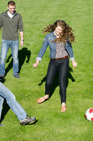 A group of students play a friendly game of soccer.