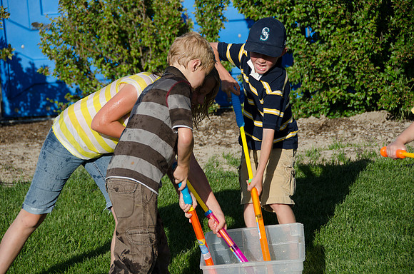 Online instructors gather with their families for an eveing of BBQ and games.